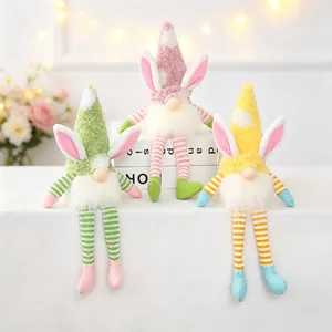 Detail view of colorful Easter plush gnomes with bunny ears and long striped legs