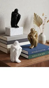 Close-up of modern abstract humanoid sculptures in a stylish home decor setting.