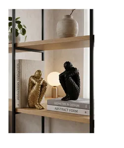 Modern abstract human sculptures with mosaic texture displayed on a wooden bookshelf decor