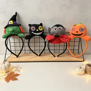 Detail view of four 3D plush Halloween headbands: witch, cat, vampire, and pumpkin.
