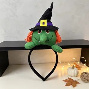 Detail shot of Halloween plush witch headband featuring orange hair and black hat