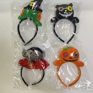 Set of four plush Halloween headbands featuring witch, pumpkin, and vampire characters
