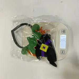 Halloween green monster plush headband weighed on a scale at 36.1g for detail reference.