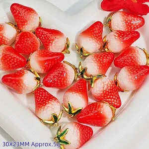 Detailed view of red strawberry resin charms for DIY jewelry making, size 30x23mm.