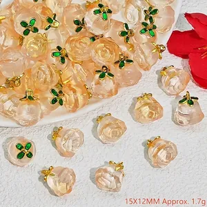 Detailed close-up view of peach-shaped crystal pendants for DIY jewelry charms