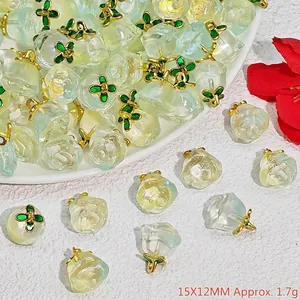 Close-up of translucent crystal peach charms for DIY bracelets jewelry making