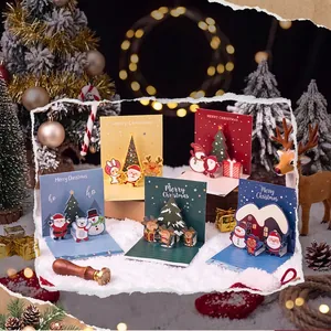 Creative 3D Christmas pop-up greeting cards in a festive winter scene setting.