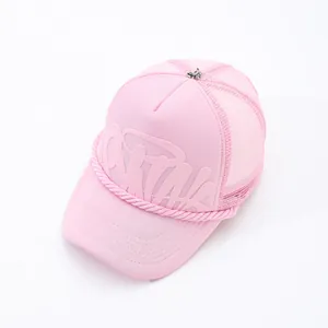 Detailed view of pink mesh trucker hat featuring embossed letter design and front rope