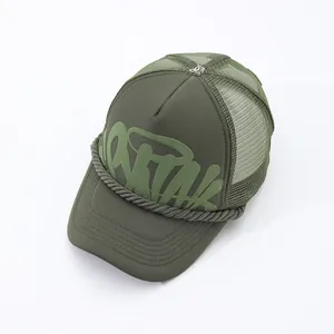Detail view of olive green trucker hat with graffiti print and rope trim