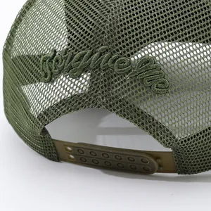 Detailed view of olive green mesh trucker hat with ForgeLife embroidery