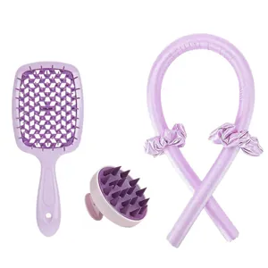 Purple hair care set with vented brush, scalp massager, and heatless curling rod