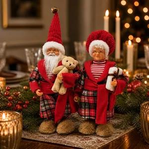 Detailed close-up of standing plush Santa and Mrs. Claus dolls in festive red robes