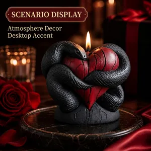 Gothic style black snake coiling around red heart candle for romantic home tabletop decor