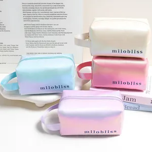 Collection of minimalist iridescent gradient laser cosmetic bags with top handle and milobliss logo