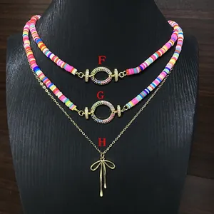 Boho handgefertigte bunte Heishi-Perlenketten und goldene Schleifenanhänger F G H