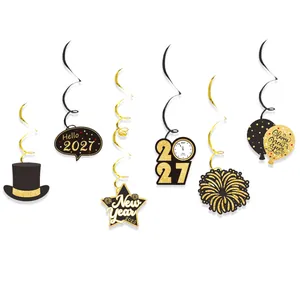 Detail view of 2027 New Year themed hanging swirl decorations in black and gold finish