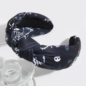 Stylish Halloween knotted wide headband with white skull and spider web patterns