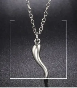 Detailed view of a polished silver-colored chili pepper pendant charm