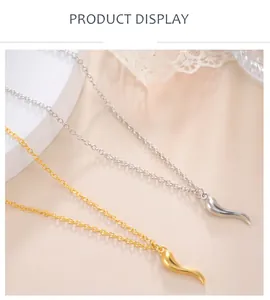 Detailed macro view of gold and silver zinc alloy chili pendant necklaces for DIY jewelry