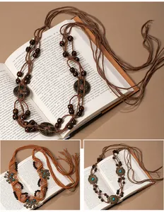 Detailed view of Bohemian hand-woven tassel belt with turquoise accents and wooden beads.