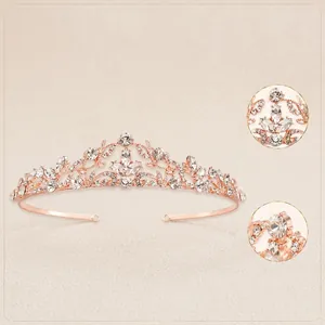 Detail of rose gold bridal tiara with multi-faceted clear rhinestones and floral openwork