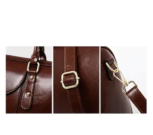 Detailed view of brown oil leather texture and gold hardware on retro Boston bag.