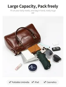 Detail view of retro brown Boston bag showing its large capacity for iPad and umbrella