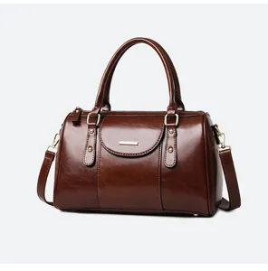 Classic vintage brown oil leather Boston bag with elegant top handles and strap