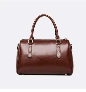 Vintage brown oil leather Boston handbag with gold-tone hardware detail