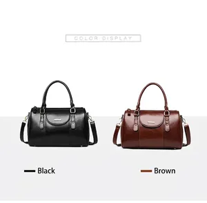 Vintage oil wax leather Boston bags in black and brown colors, detail view of colors.