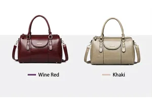 Vintage oil leather Boston pillow handbags shown in Wine Red and Khaki color variants