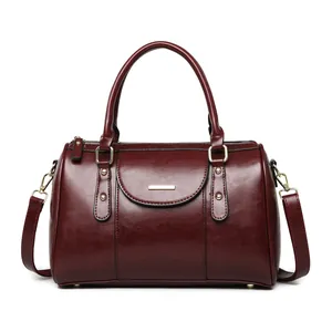 Elegant vintage burgundy oil leather Boston handbag with top handles and shoulder strap