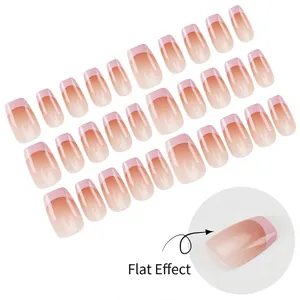 Close-up detail of short ballerina pink blush gradient French tip press-on nails set