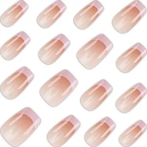 Detail view of pink French blush gradient press-on nails with a short ballet shape.
