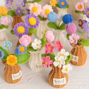 Hand-crocheted colorful potted flower plants with tulips and roses for home decor