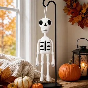 Handcrafted knitted skeleton doll for Halloween home and window decoration