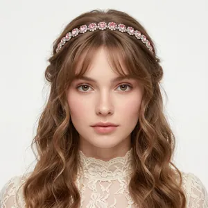 Elegant silver metal headband with pink crystals worn by a model on white background