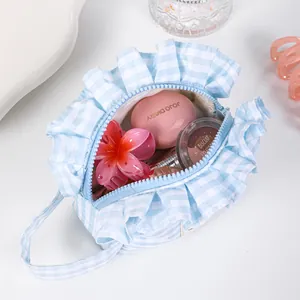 Fresh light blue gingham makeup bag with ruffles and portable handle for cosmetics