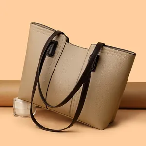 Elegant beige large capacity tote bag with dark brown straps for daily commute