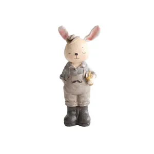 Figura de conejo lindo estilo Zakka que sostiene un libro para decoración de hogar