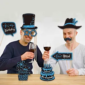 Set of glittery blue and black birthday photo booth props shown in a celebratory party scene