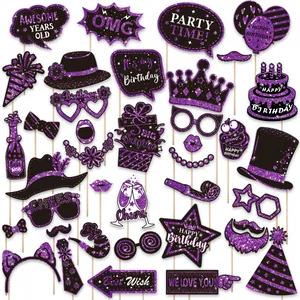 Close-up of 38-piece purple and black glitter birthday party photo booth props set