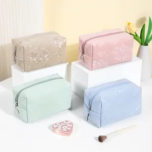 Elegant floral embossed PU leather makeup bags in pastel colors, travel cosmetic pouch