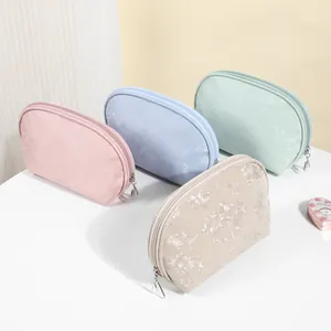 Elegant waterproof PU makeup bags in 4 Morandi colors, semi-circle travel storage.