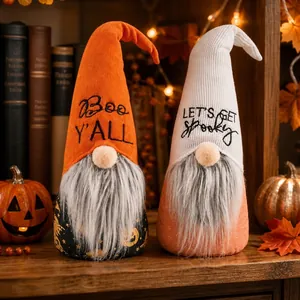 Close-up view of two decorative Halloween gnomes with Boo Y'ALL and Spooky text on hats
