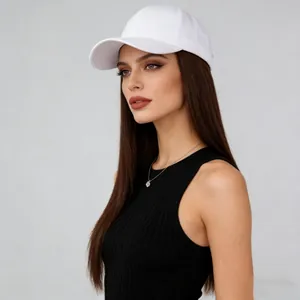 Close-up detail of model wearing a white baseball cap with integrated long straight brown wig
