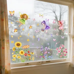 Pastorale vensterstickers met feeën, zonnebloemen en vlinders op glazen panelen.