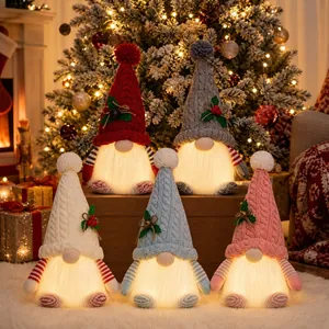 Set of five glowing Christmas gnomes with colorful knitted hats in a festive scene