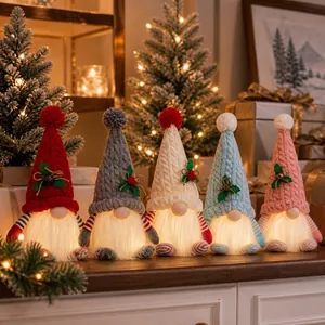 Detailed view of five colorful LED Christmas gnomes with glowing beards and knitted hats.