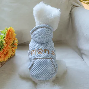 Close-up of the light blue waffle-textured hooded pet sweater with embroidery detail